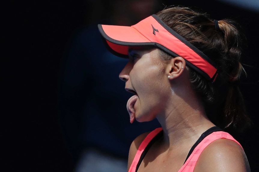 Lauren Davis sticks out her tongue during her third-round match against Simona Halep at the Australian Open.