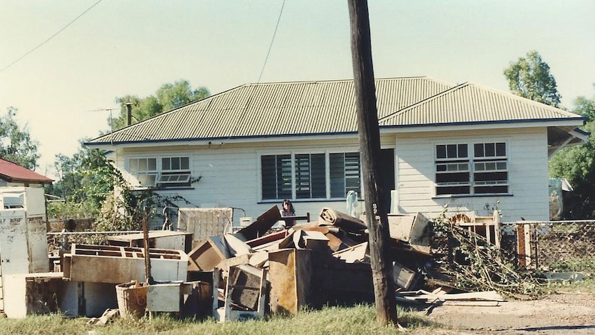 Flood-damaged home with muddy debris outside in Charleville in 1990