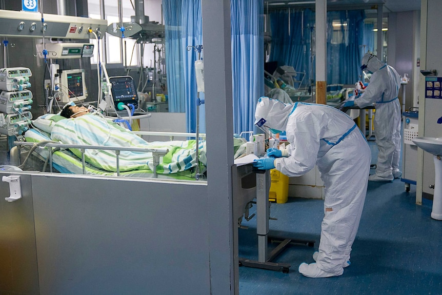 A medical worker attends to a patient in the intensive care unit at Zhongnan Hospital of Wuhan University.