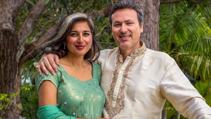 Musician husband and wife Niyati and Gavin Libotte wear traditional Indian clothing.