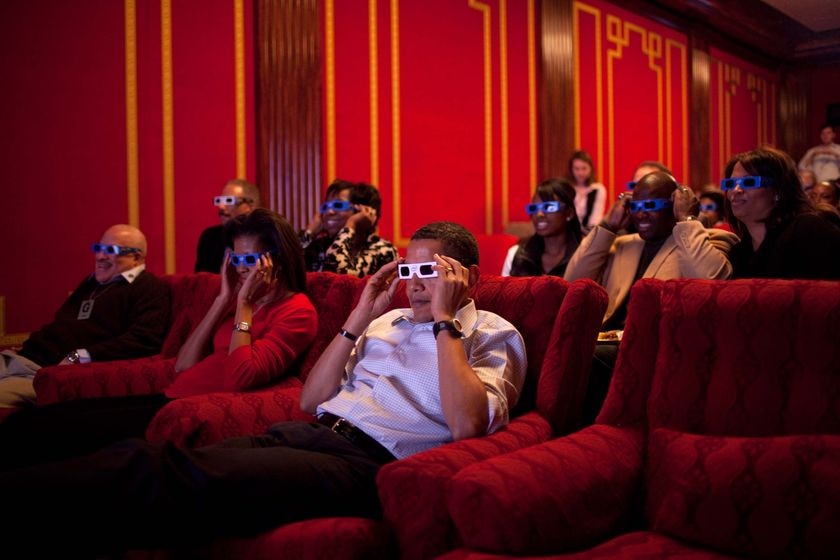President Barack Obama and First Lady Michelle Obama wear 3-D glasses while watching the Super Bowl