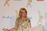 Kerri-Anne Kennerley wears a glittering dress on the red carpet
