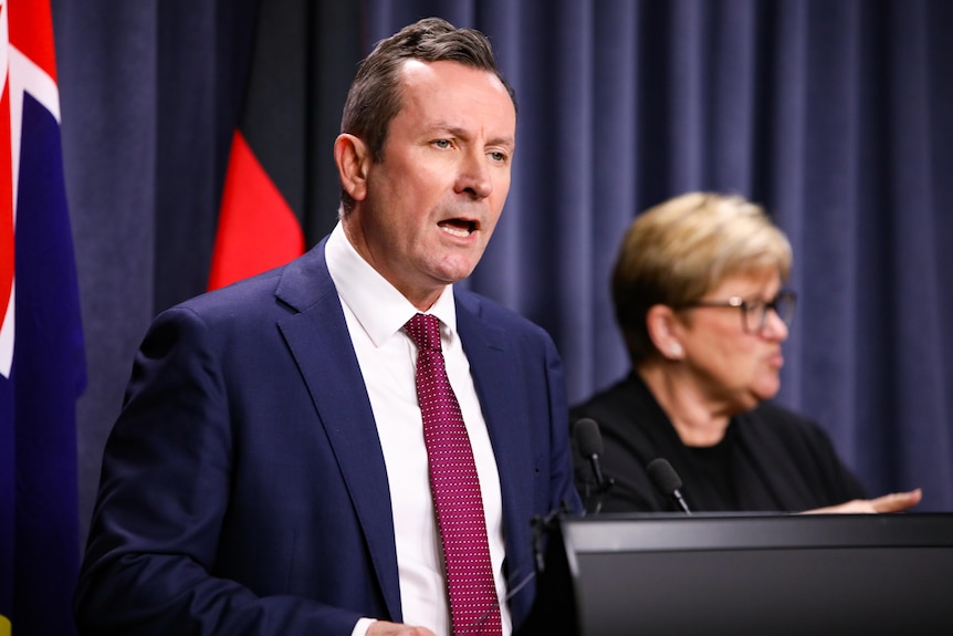 Premier Mark McGowan speaking at a media conference indoors.