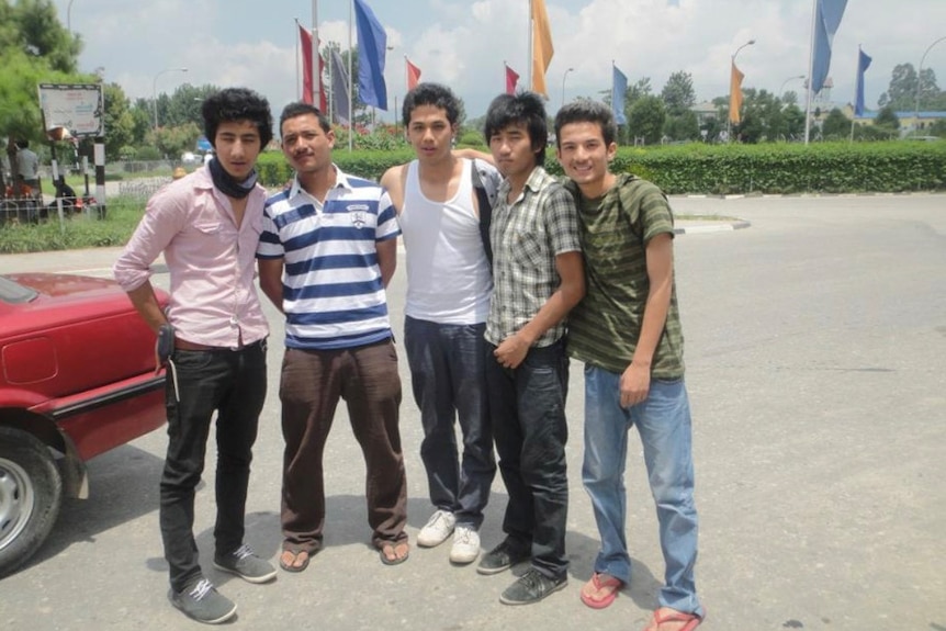 A group of young men stand together in Kathmandu in Nepal.