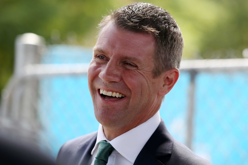 NSW Premier Mike Baird smiles at a press conference in Sydney.