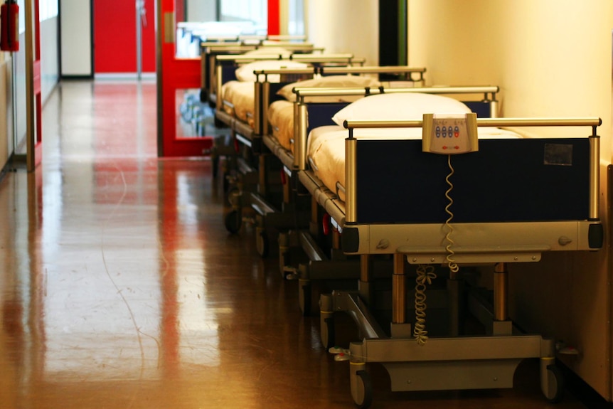 Hospital beds in a corridor.