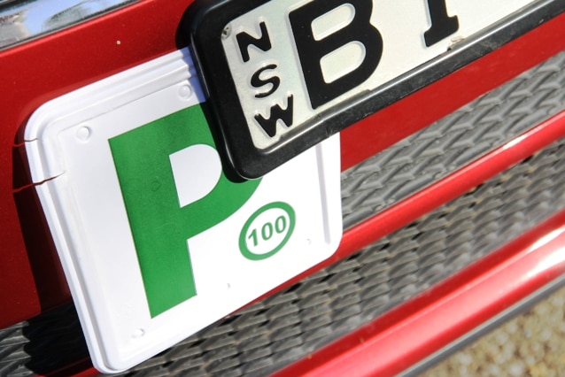 generic green P plate on car