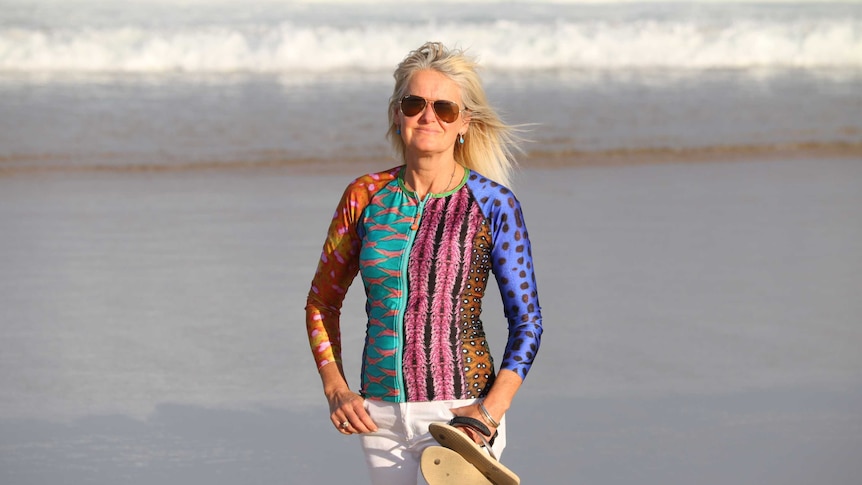 Vivien Mitchell standing on a beach.