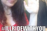 A woman holds up her hand with the caption #illridewithyou underneath