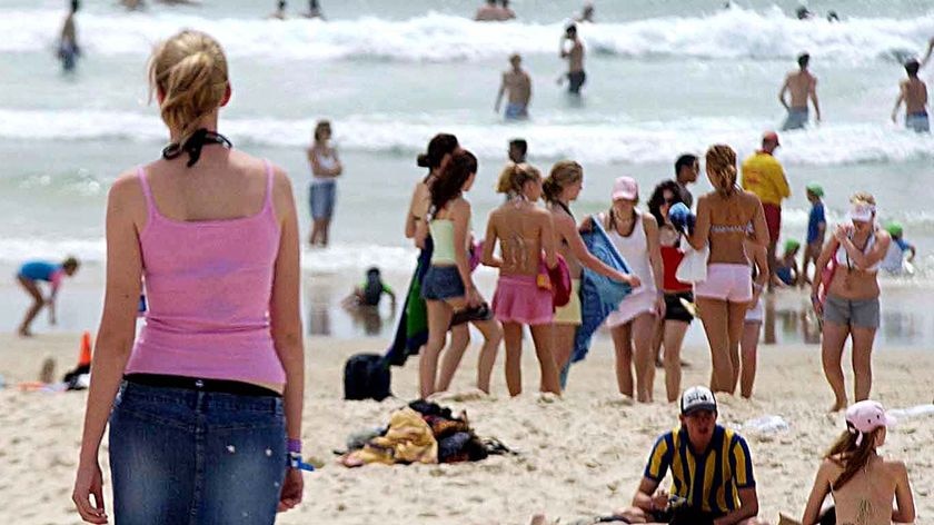Teenagers on the beach during schoolies week.