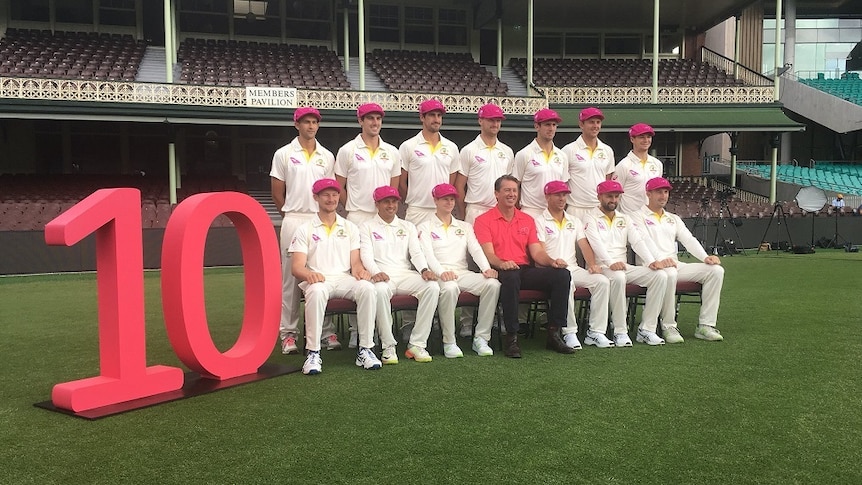 Australian cricketers wearing pink caps with Glenn McGrath to celebrate 10 years of the Pink Test.
