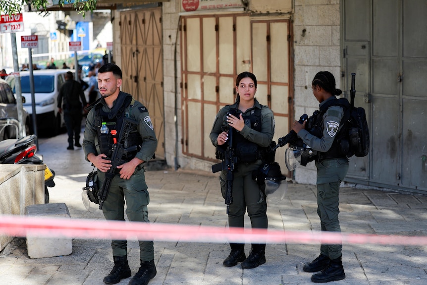 Israeli officials work at the scene of an incident in Jerusalem November 6, 2023