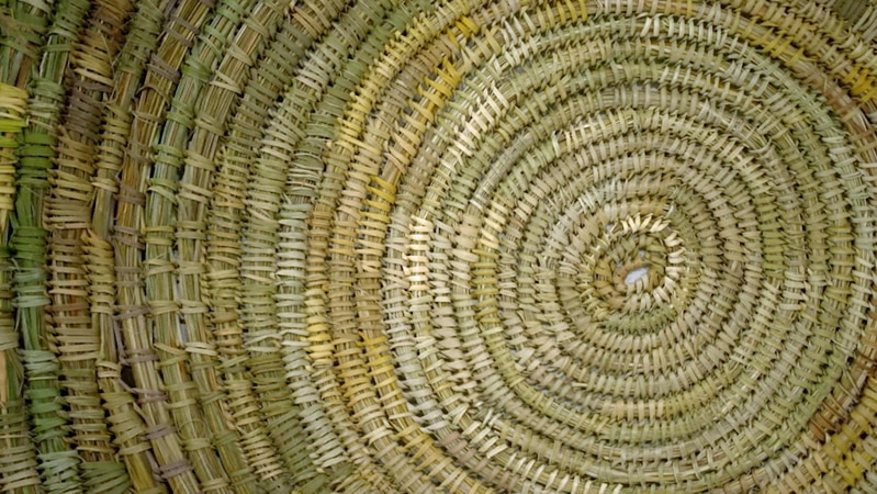 Grass woven into a spiral mat
