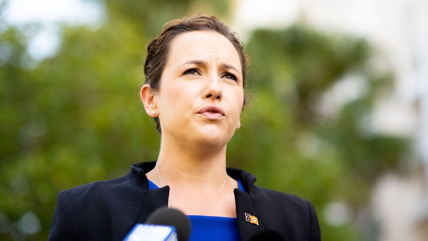 A photo of NT Opposition Leader Lia Finocchiaro making an announcement. She is wearing a blue top and black blazer.