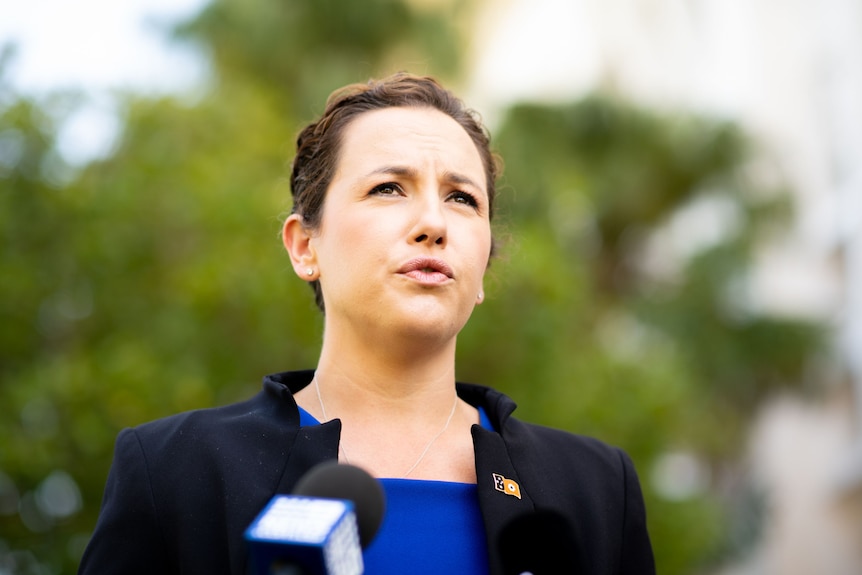 A photo of NT Opposition Leader Lia Finocchiaro making an announcement. She is wearing a blue top and black blazer.