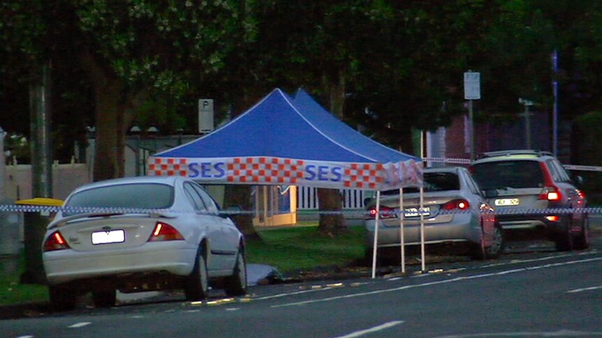 An SES tent and police tape on a street in Geelong.