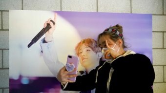 A fan of K-pop boy band BTS takes a selfie