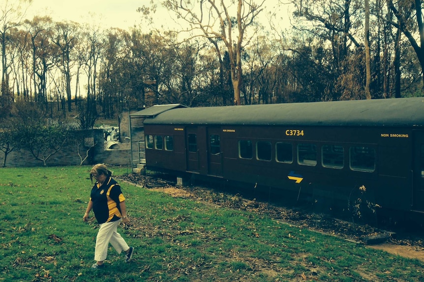 Margaret Bell with the 'red rattler' restored rail carriage