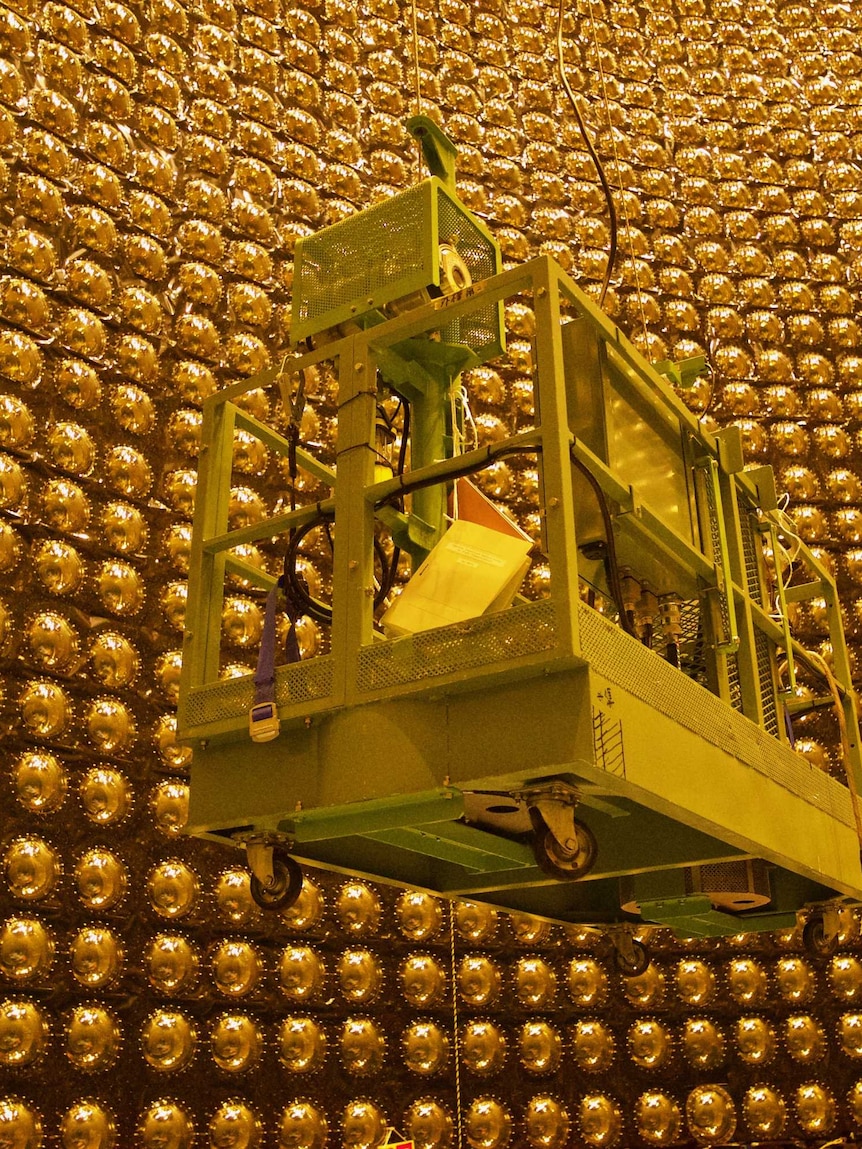 A platform suspended from the roof of Super Kamiokande