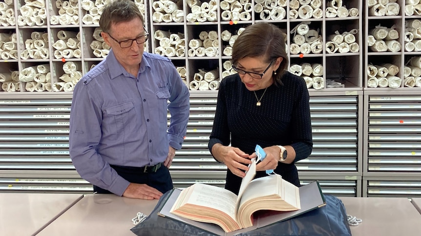 Chris Salisbury and Leanne Enoch look through cabinet documents