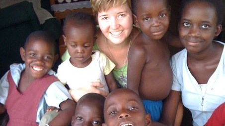 Griffith University law lecturer Kate Van Doore with rescued Ugandan children in July 2011.