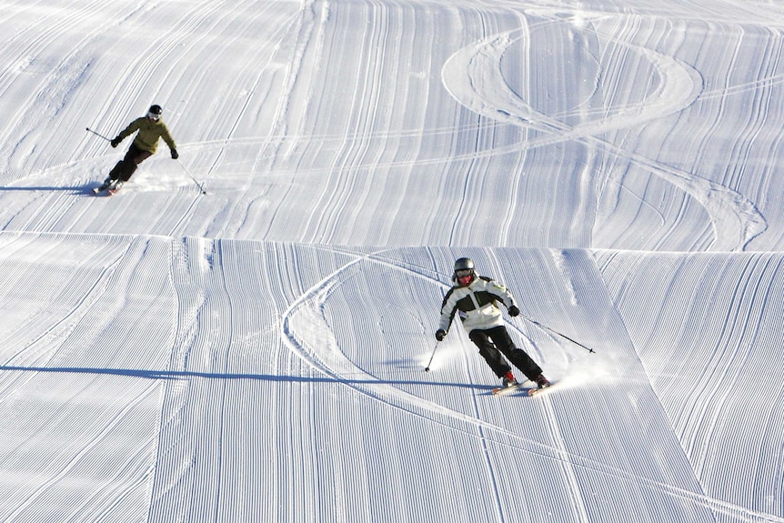 Skiers enjoy new snow.