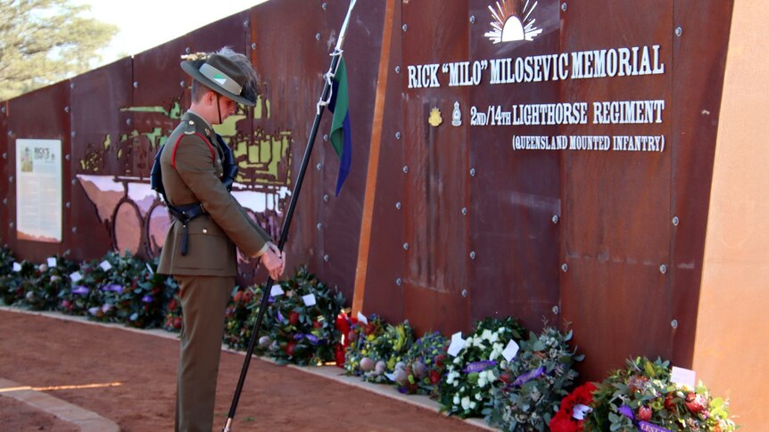 Army soldier paying respect at Stjepan 'Rick' Milosevic Memorial
