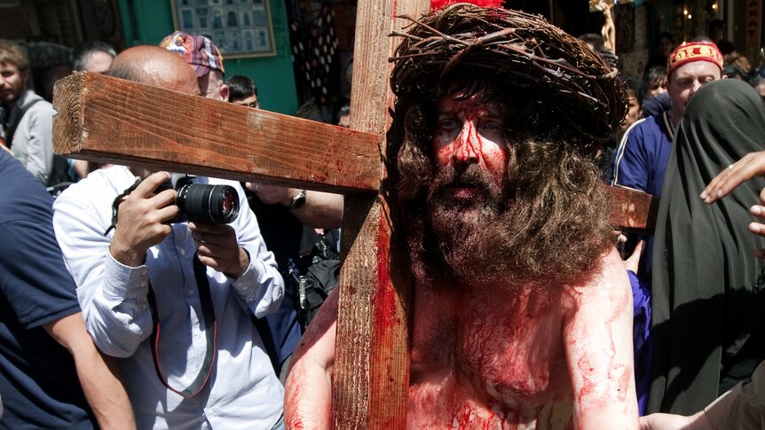 Tony Khalil, a Christian pilgrim from Nazareth, re-enacts the crucifixion of Jesus Christ along the path where Jesus walked.