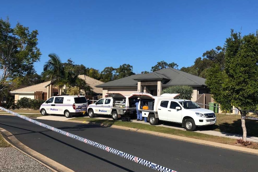 Forensic investigators outside a home on Topaz Drive at Mango Hill, north of Brisbane.