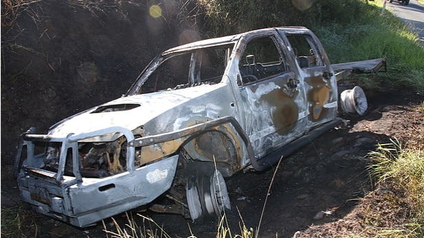 Blackened wreck of burned ute