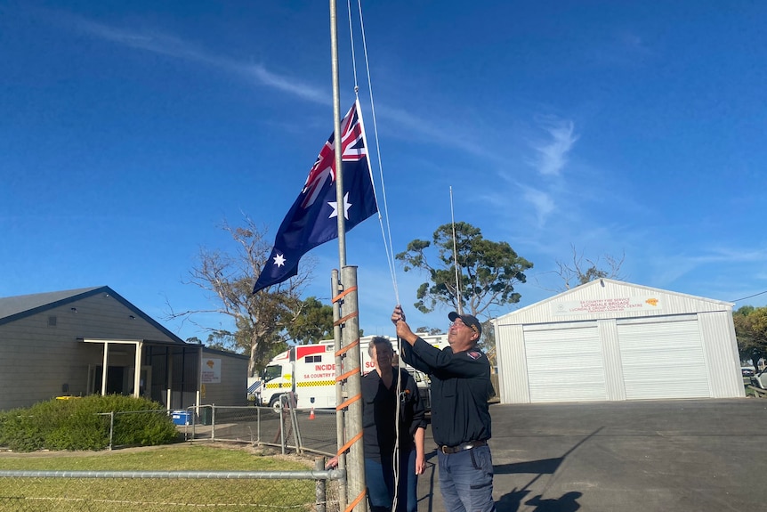 A flag lowered to half-mast in tribute to a CFS volunteer killed on a fire ground.