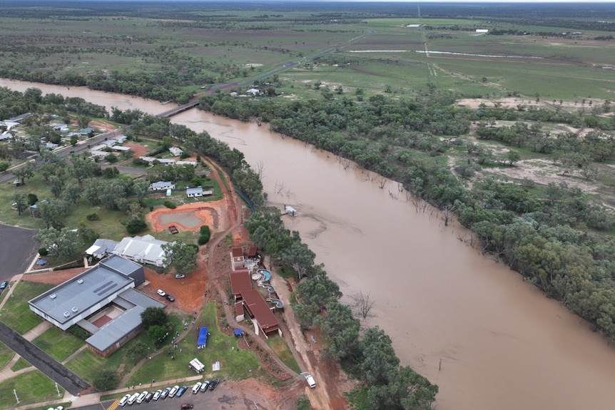 An aerial shot of Cunnamulla, showcasing the brown Warrego river