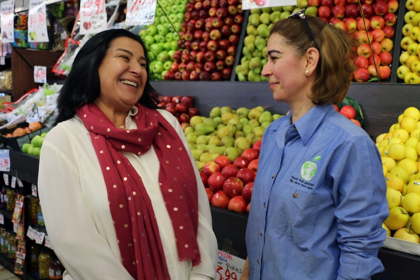 Principal of Holy Saviour Catholic School Dianne Klumpp (left) with a local Greenacre business owner.