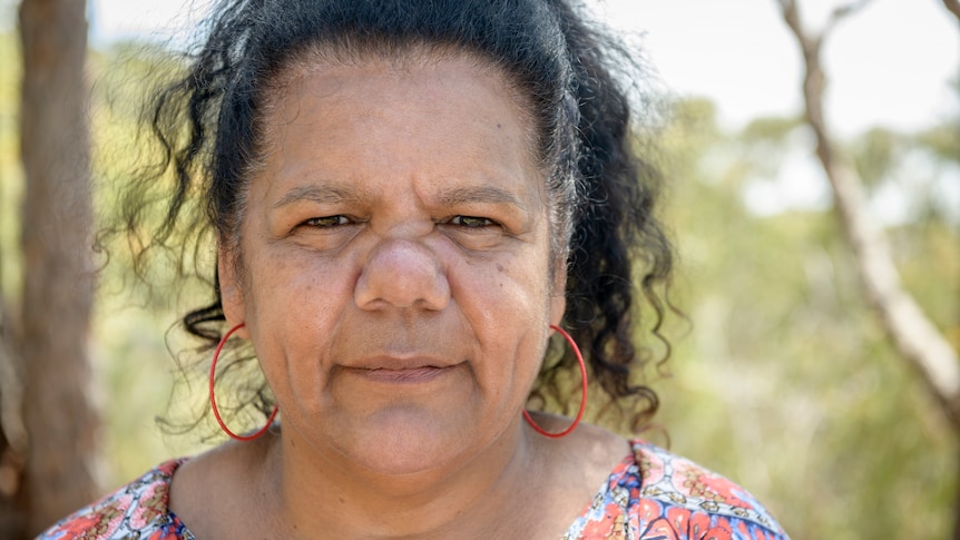A close up of an Aboriginal woman looking at the camera