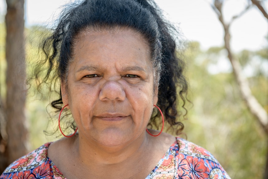 A close up of an Aboriginal woman looking at the camera