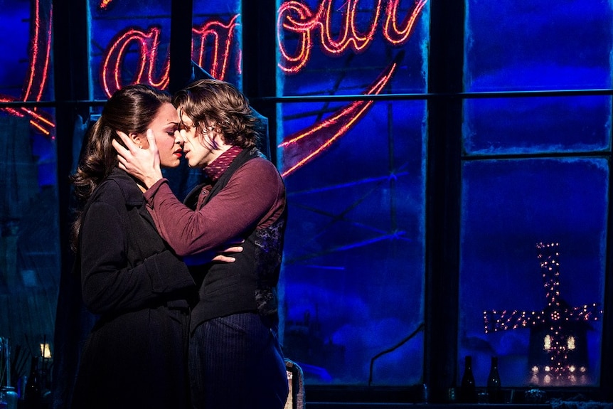 Moulin Rouge! production photos of Karen Olivo as Satine and Aaron Tveit as Christian.