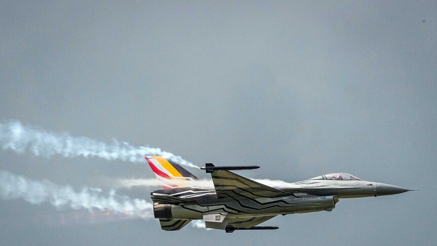 A Belgian F16 fighter jet flies over Florennes Military Airbase, in Florennes, Belgium.