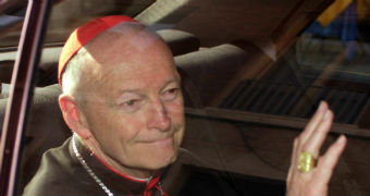 Cardinal Theodore McCarrick of the Archdiocese of Washington, waves as he arrives at the Vatican in a limousine.