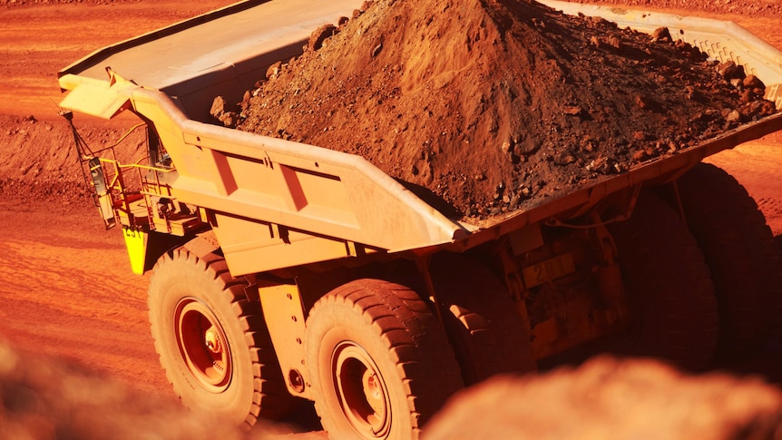 A truck works at a iron ore mine at Newman in the Pilbara region of Western Australia.