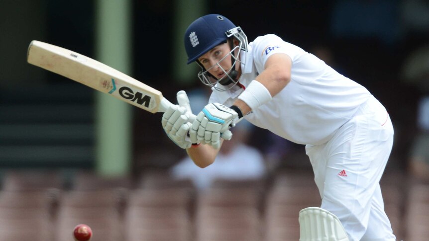 Joe Root plays an on-drive against Invitational XI