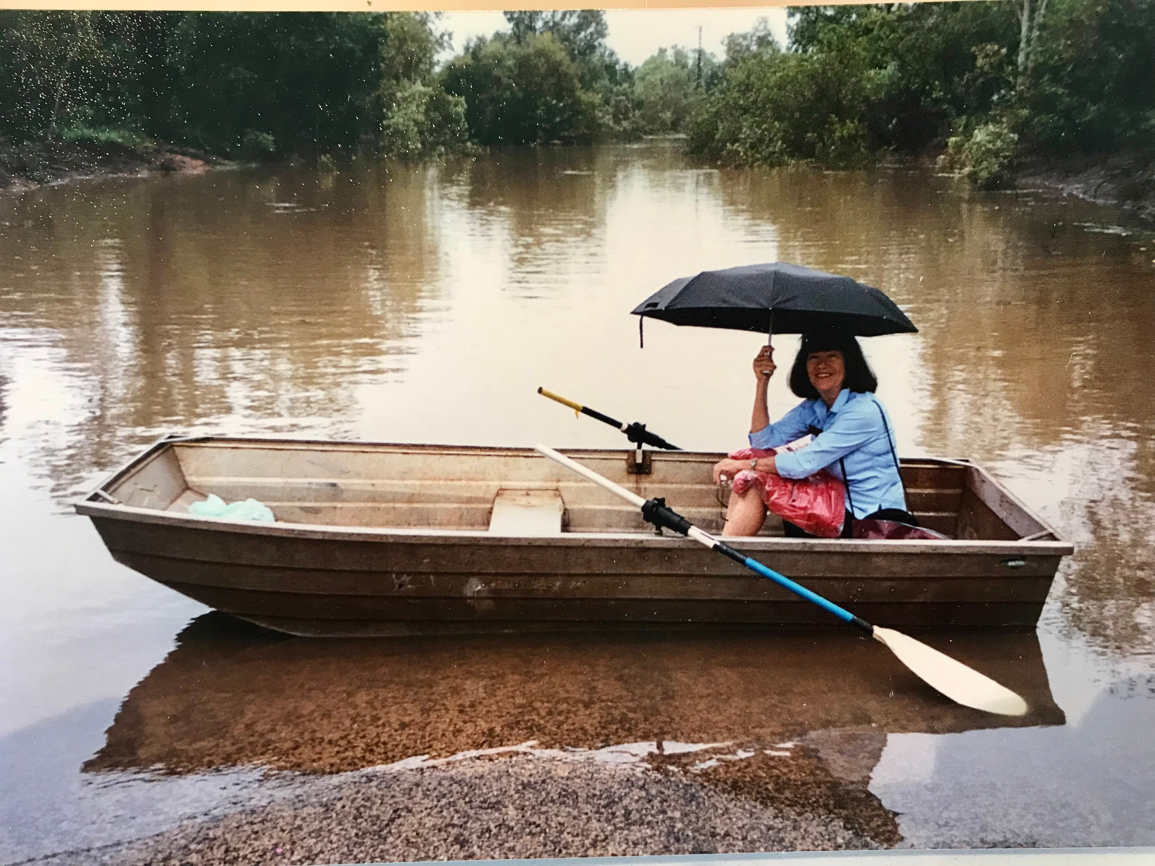 An historic photograph of Nola Sweetman in a boat. 