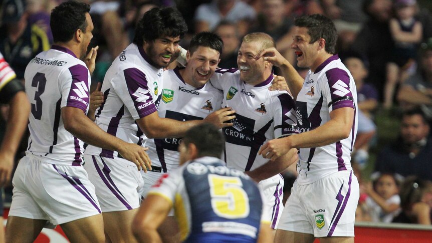 Melbourne Storm players celebrate Ryan Hinchcliffe's try against the Cowboys in their 32-10 win.