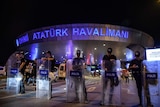 Turkish anti riot police officers block the main entrance with shields