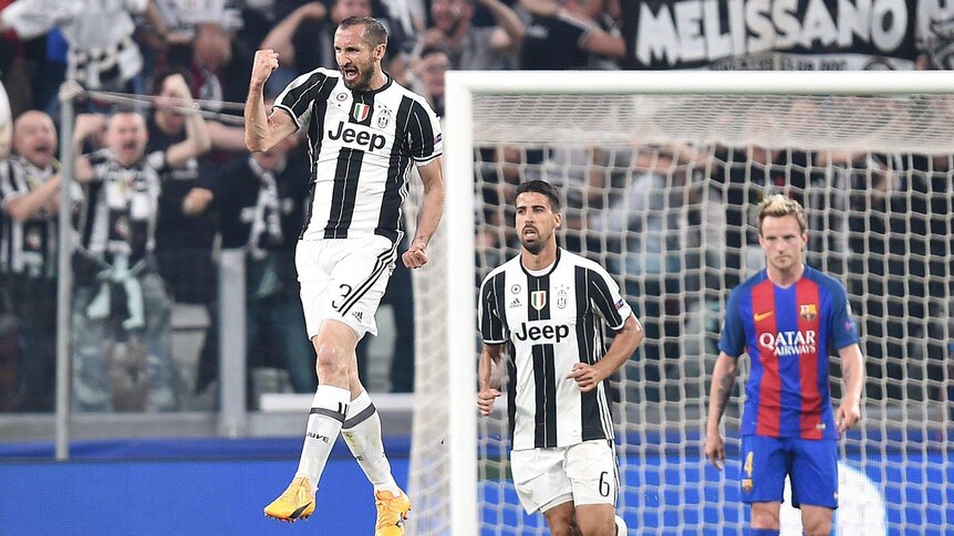 Giorgio Chiellini celebrates after scoring the third goal for Juventus against Barcelona.