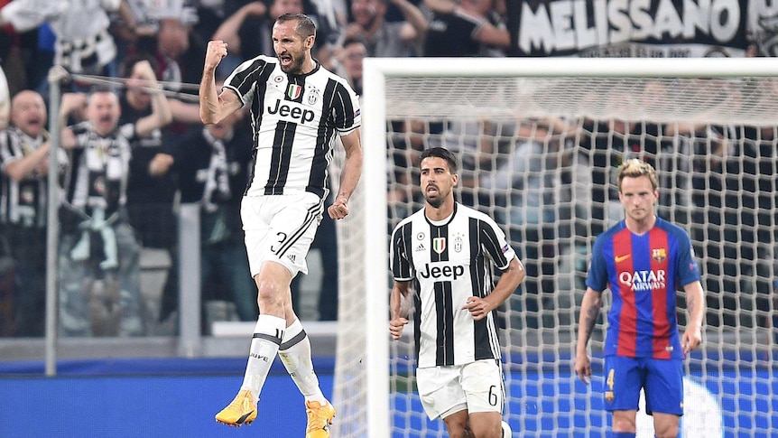 Giorgio Chiellini celebrates after scoring the third goal for Juventus against Barcelona.