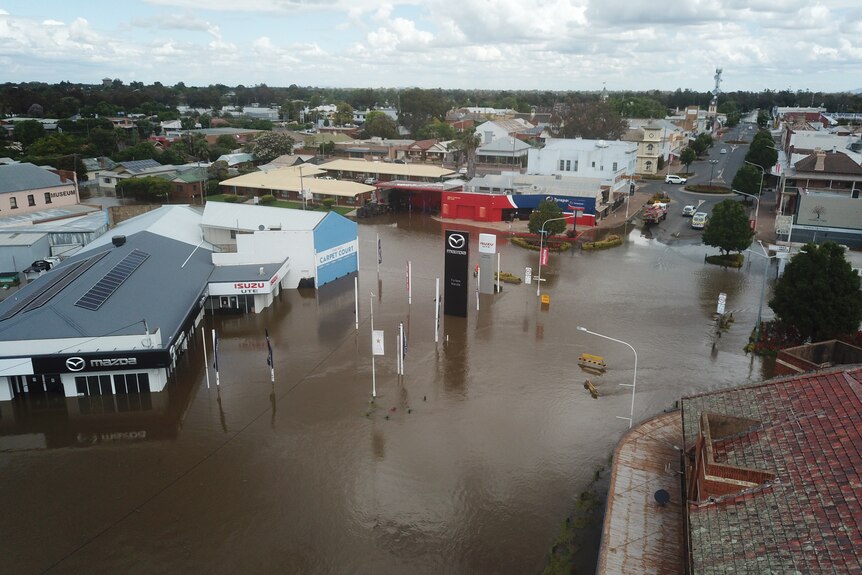 A drone image showing floodwater in the town of Forbes, with buildings surrounded by water