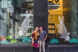Artists Elysha Rei and Vanghoua Anthony Vue standing in front of the Japanese cut outs in Eagle Lane, Brisbane.