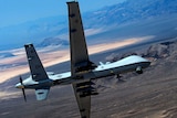 An MQ-9 Reaper unpiloted drone performs aerial manoeuvres