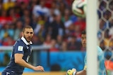 Karim Benzema sends the ball towards goal for France's second