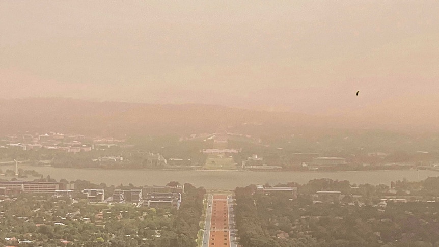 Dust obscures the view of Canberra from up high.